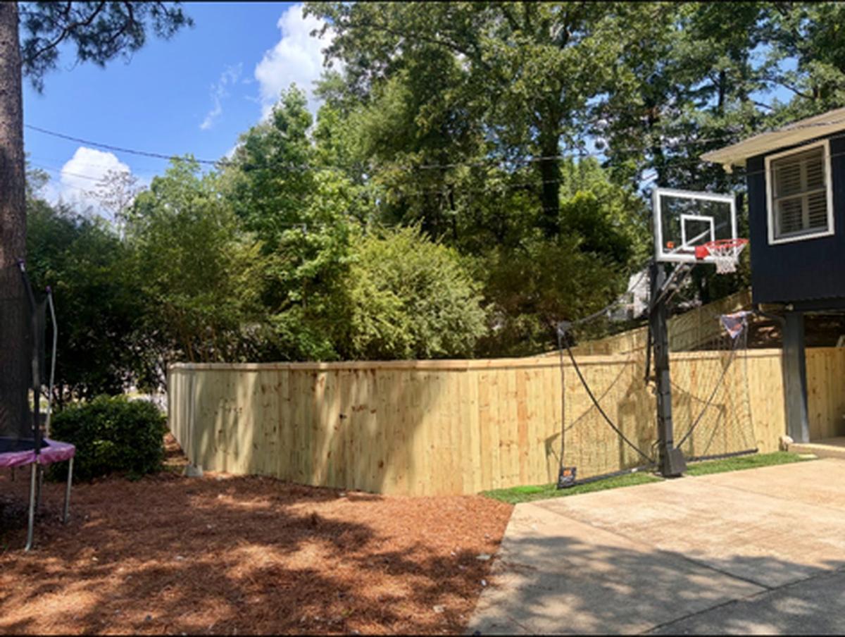 Residential fence built by Redbone Woodworks