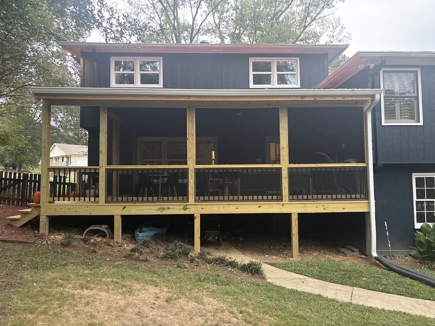 Screened porch and deck addition built by Redbone Woodworks